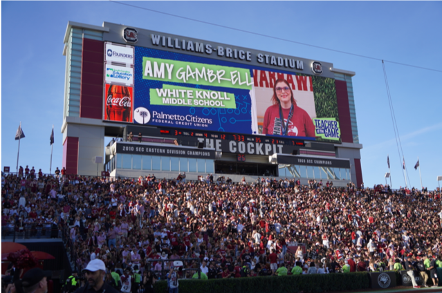 Williams-Brice Stadium scoreboard recognizing Amy Gamble Ellis as Teacher of the Game.